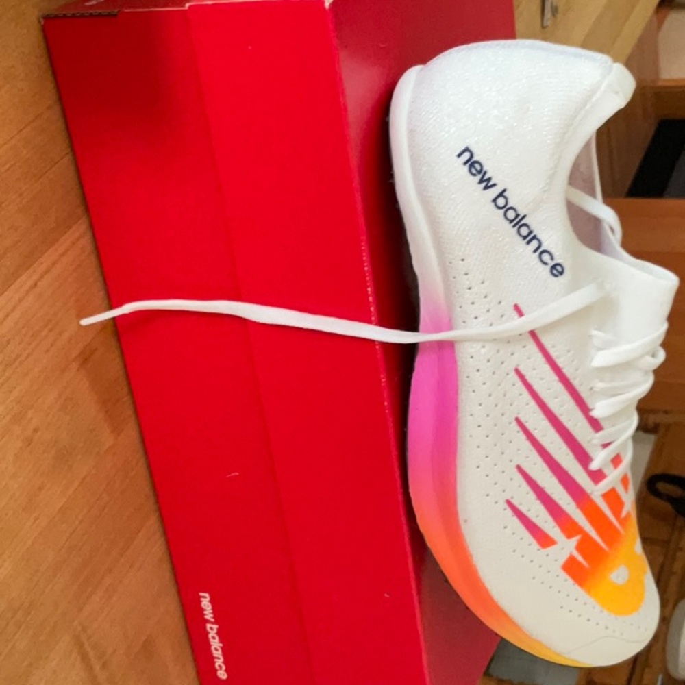 New Balance White Athletic Shoes with Pink and Orange Accent